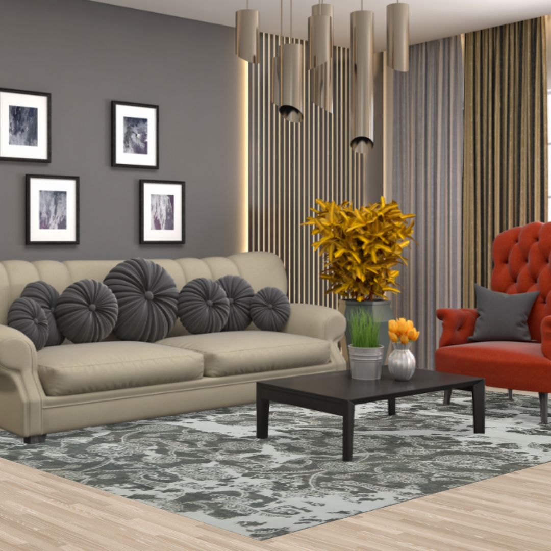 The same modern living space with beige sofa and orange armchair, this time emphasizing the gray and black patterned rug beneath the coffee table.